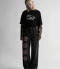 Cherry Paw Graphic Low-Rise Baggy Jeans in Black Wash