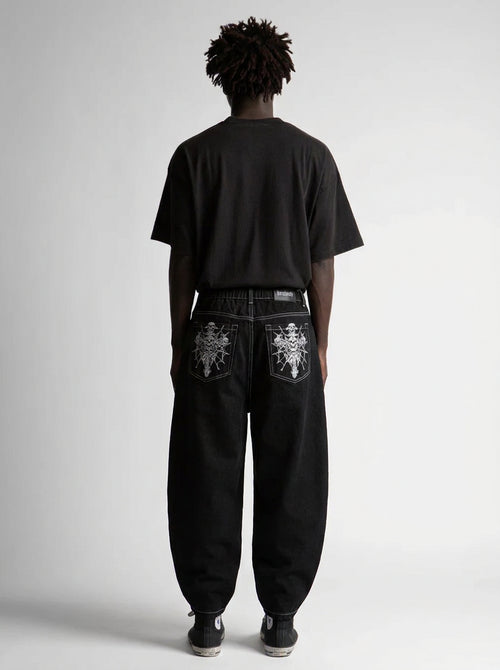 Grave Skeleton Pocket Baggy Jeans in Black Wash