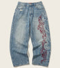 Inferno Tribal Embroidered Baggy Jeans in Washed Blue