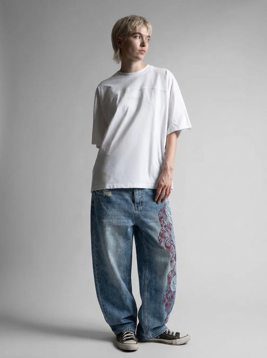 Inferno Tribal Embroidered Baggy Jeans in Washed Blue