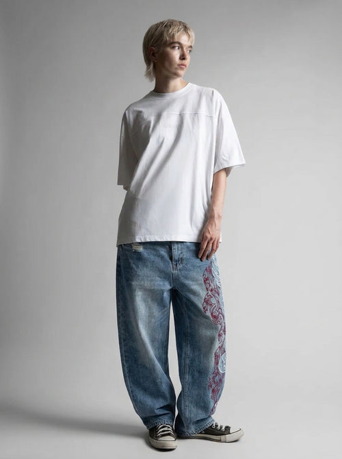 Inferno Tribal Embroidered Baggy Jeans in Washed Blue