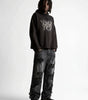 Riot Vintage Ripped Wide Leg Denim Jeans in Washed Black